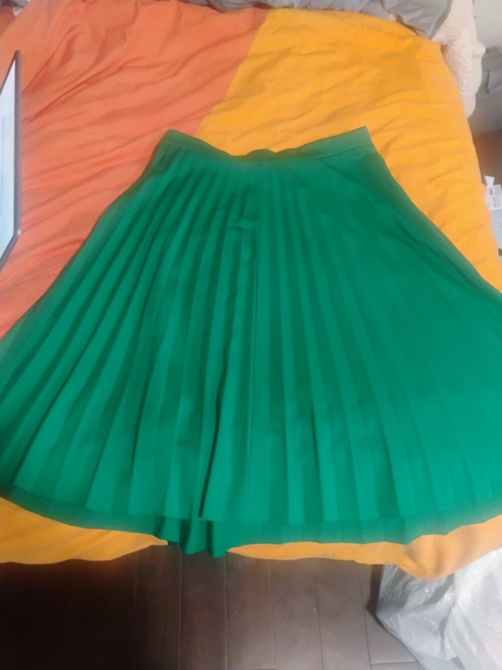 Green pleated skirt